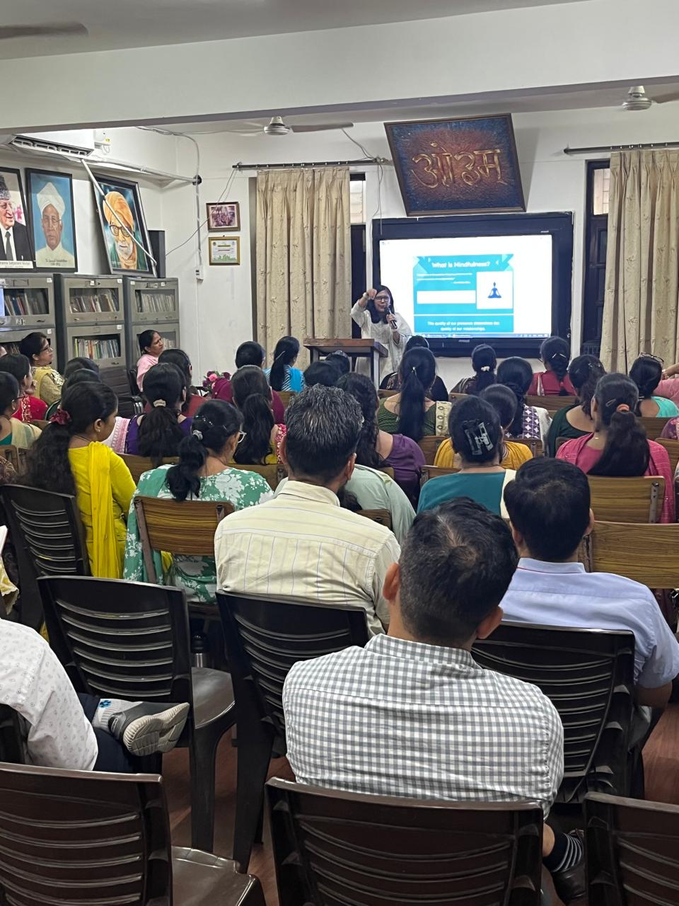 Rekha leading a group coaching session with parents